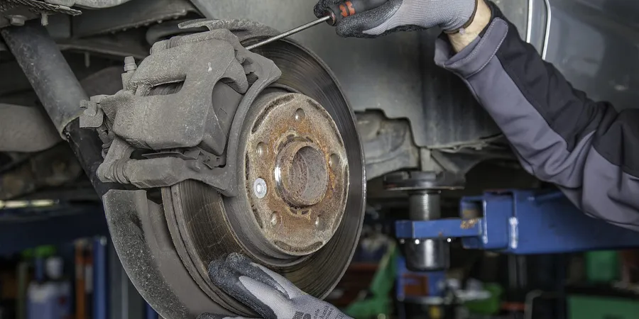 Mechanic checking brake disc