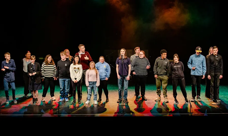 Thriftwood College's choir on stage. Photo by Aaron Crowe.