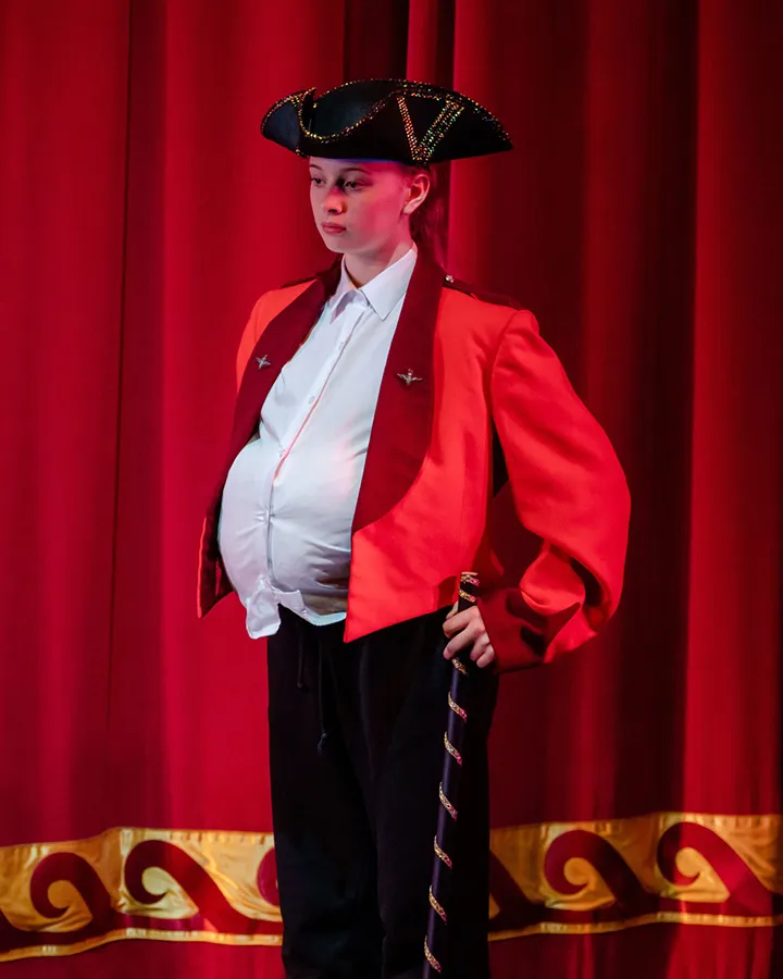 A student from The Boswells School in costume on stage. Photo by Aaron Crowe.