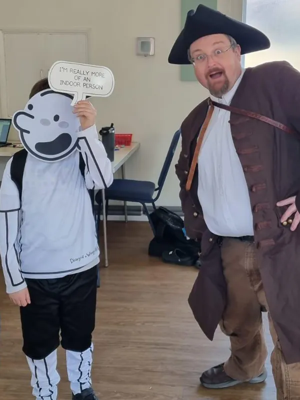 Rob and a pupil on World Book Day