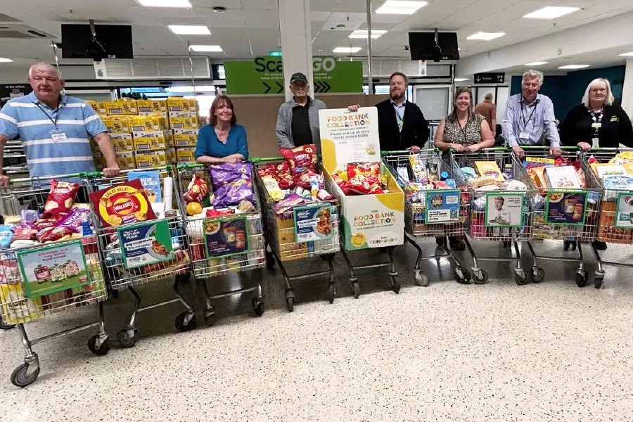 Lisa far right, with some (not all) of the Rotarians and helpers who collected nine trolley loads of supplies throughout the day