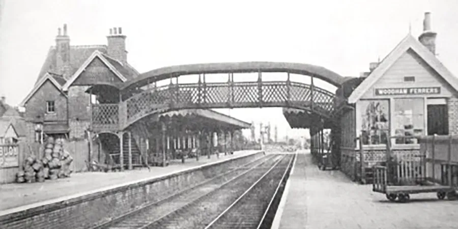 Old black and white photo of the original train station in South Woodham Ferrers