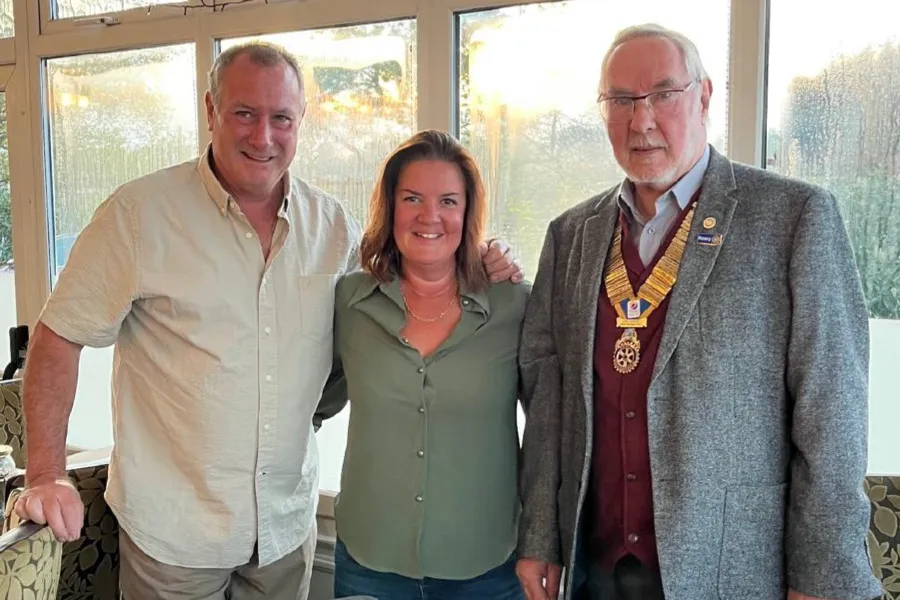 Terri Smith, flanked left in the photo by her partner Rotarian Julian Waller, and our President Rtn Roger Restell on the right