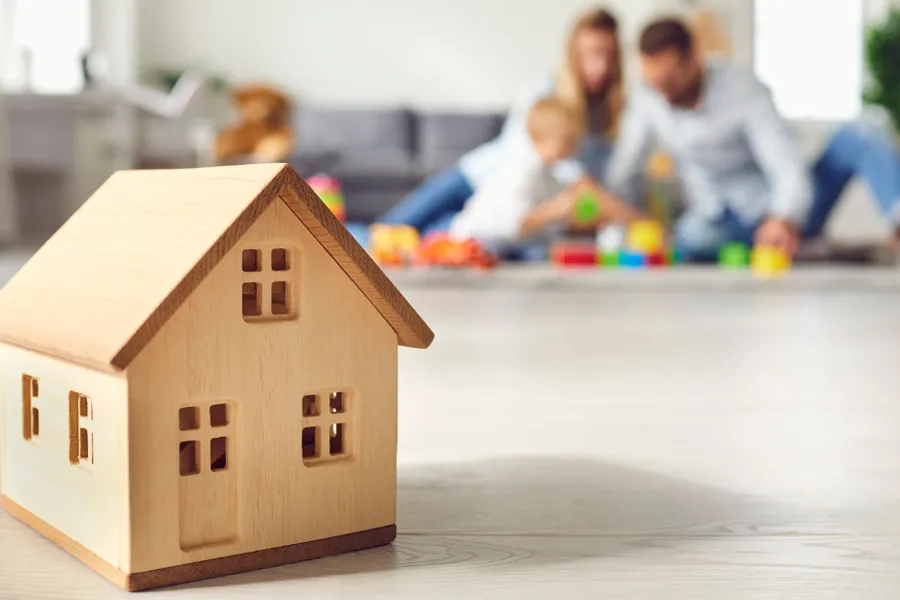 Family with toddler playing at home