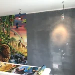Wallpapering a wild animal scene in progress