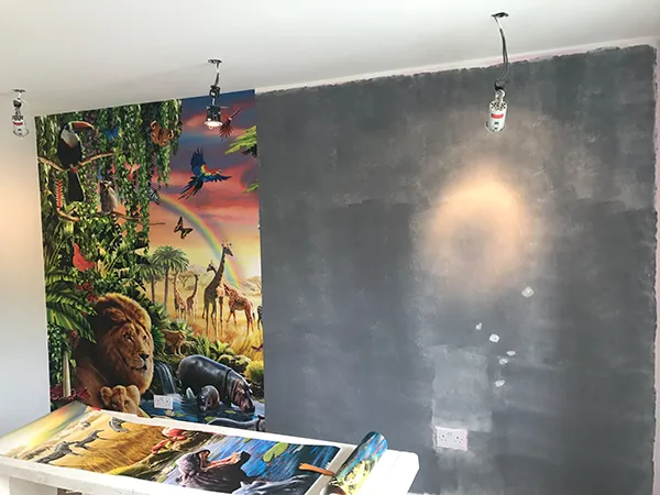Wallpapering a wild animal scene in progress