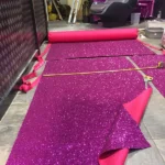 Cutting purple glittering wallpaper to size