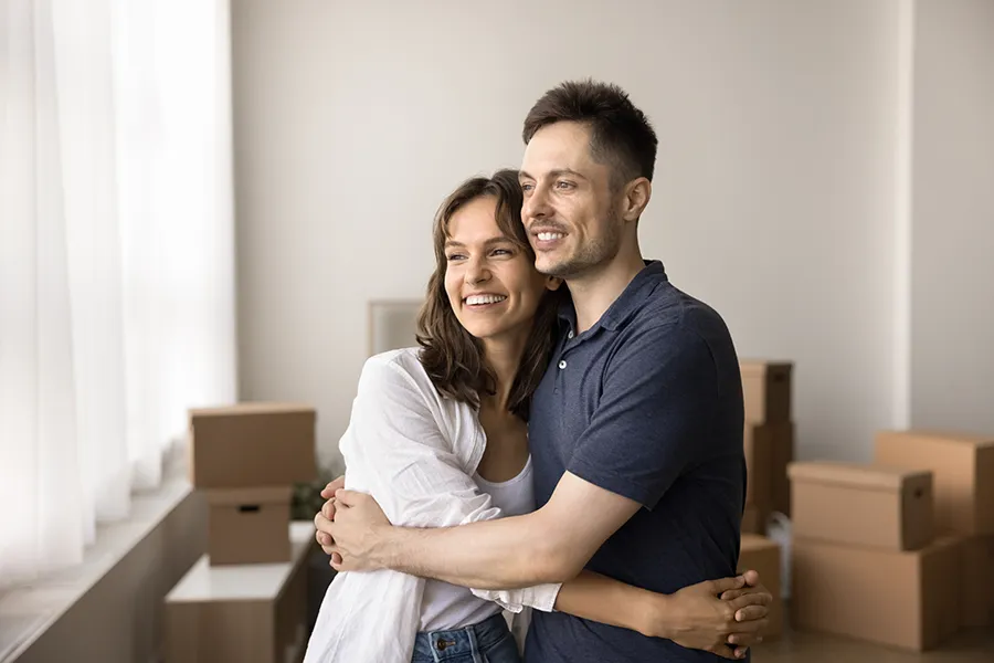 Happy young couple just moved in to a property