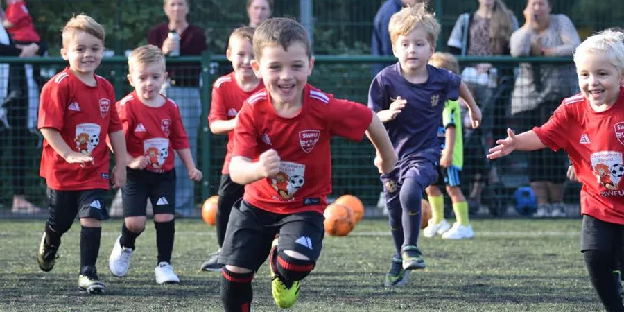 Young SWFU footballers enjoying playing a football game