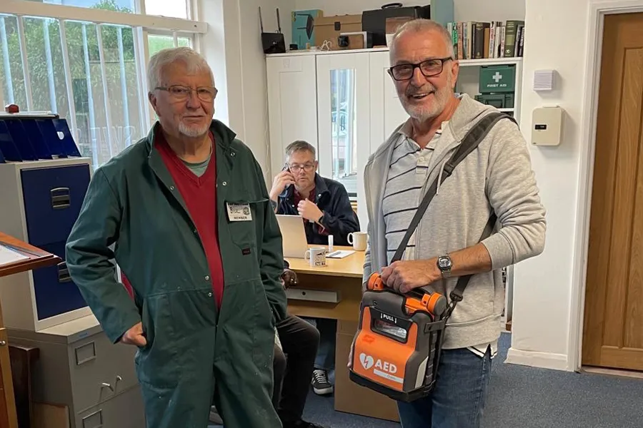 Members of the Men's Shed with their new automated external defibrillator