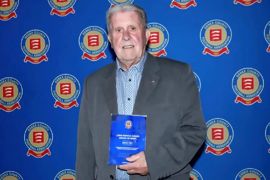 Rtn Mick Fry holding his award