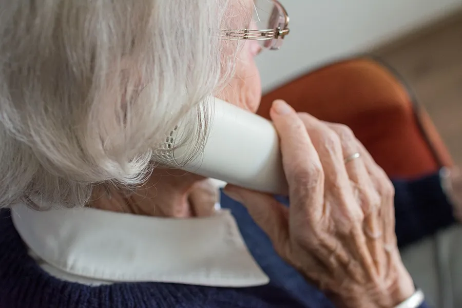 Elderly lady on the phone.