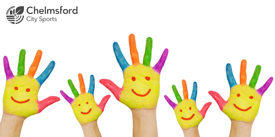 Hands painted with smiling faces