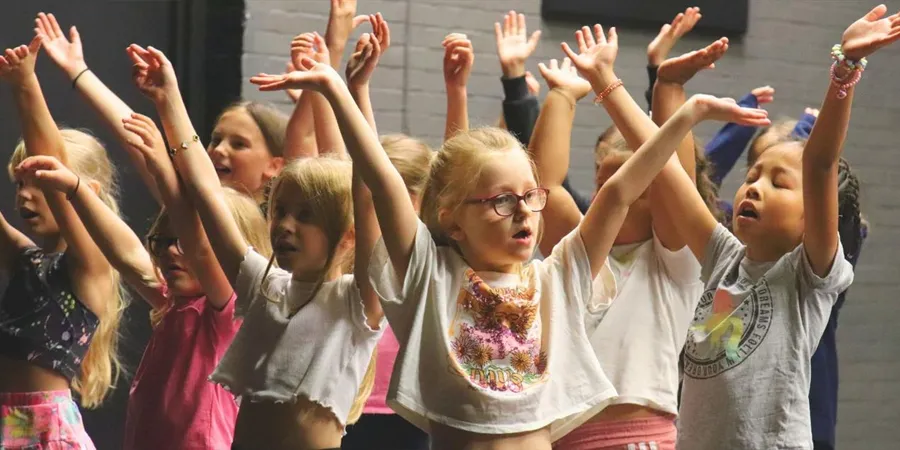 Children performing musical theatre