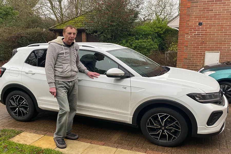 Gary next to his car