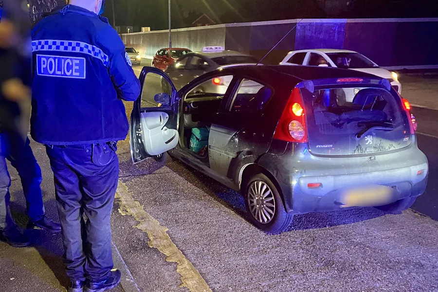 Police stop a vehicle